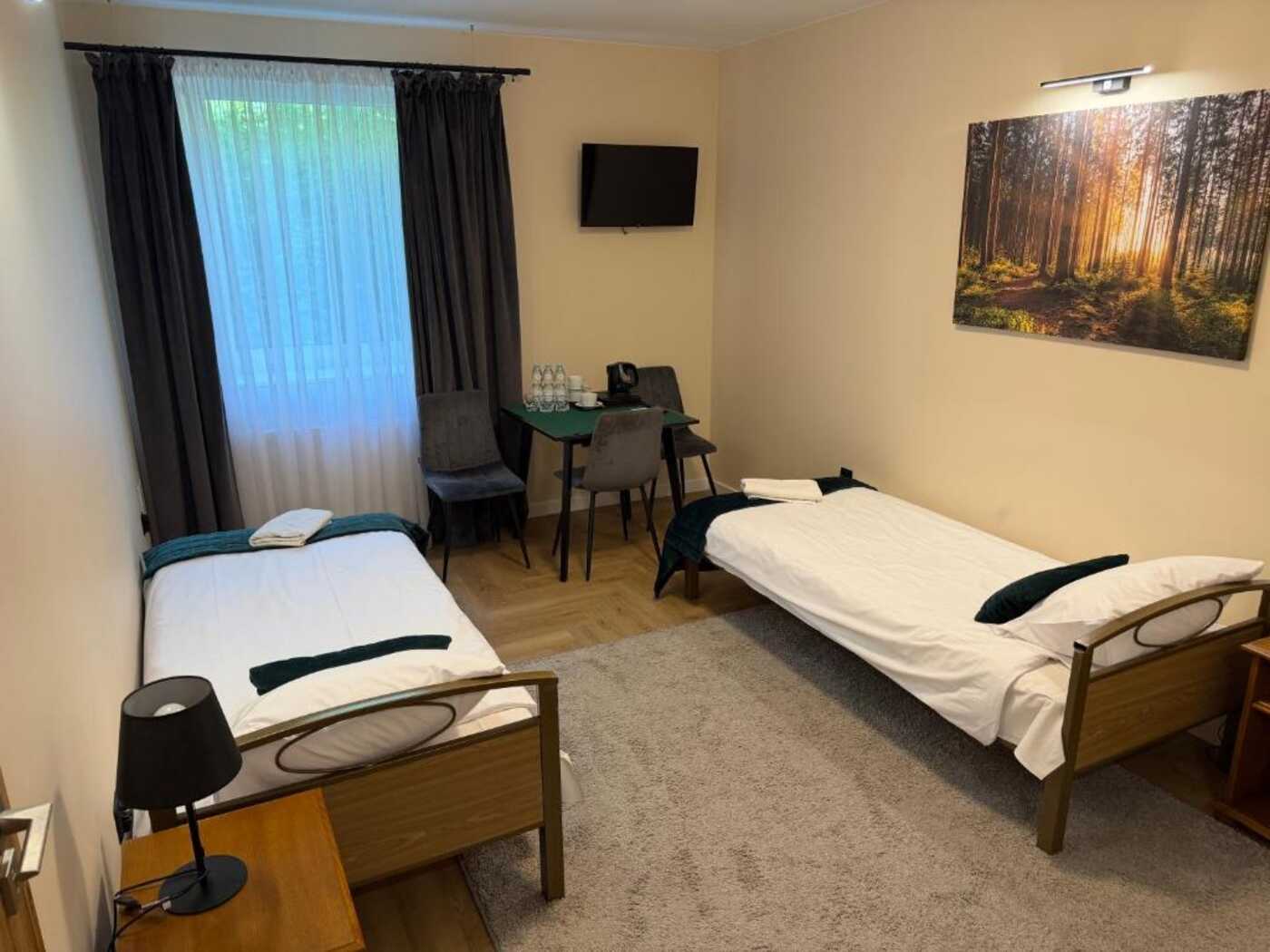 Pokój trzyosobowy z współdzieloną łazienką